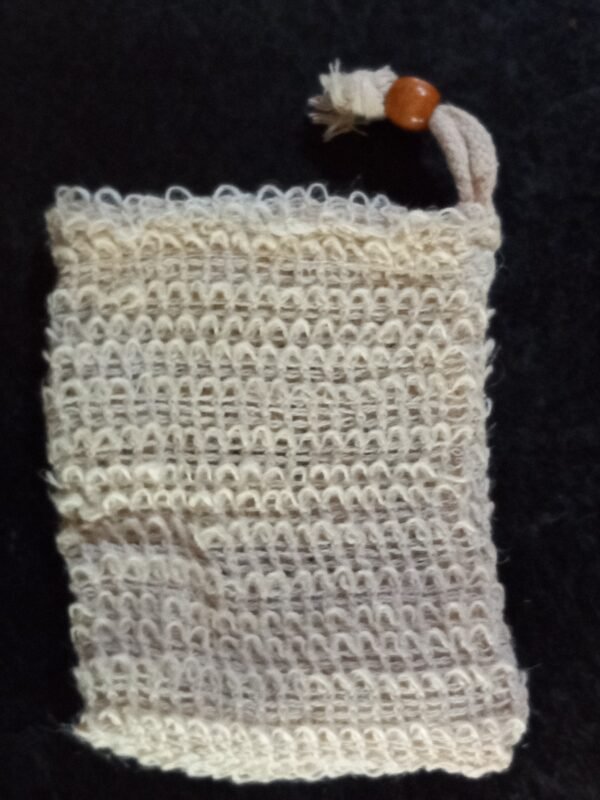 A beige woven bag approximately 3 inches by 4 inches with a drawstring closure