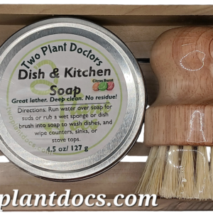 wooden tray with round dish soap in steel tin and dish brush