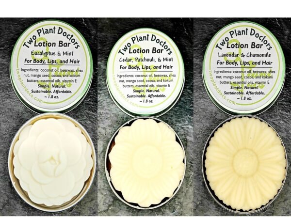 three round tins each containing flower shaped lotion bars