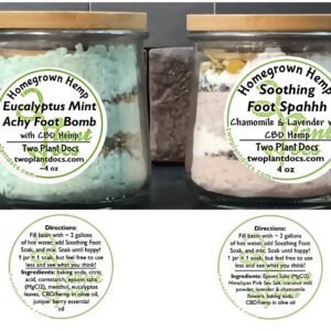 two small glass jars containing colored powders and herbs