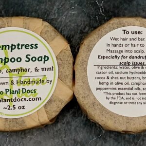 Two round Hemptress Shampoo Soaps with hemp, camphor, and mint