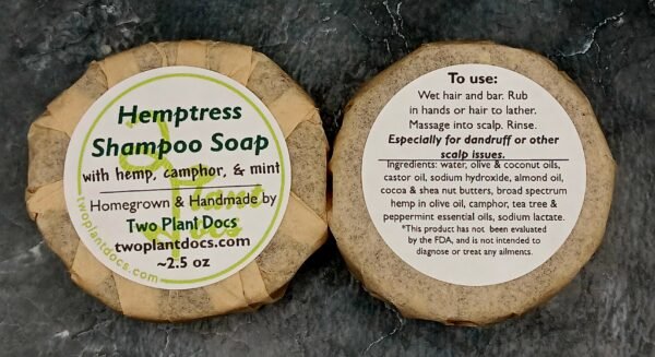 Two round Hemptress Shampoo Soaps with hemp, camphor, and mint