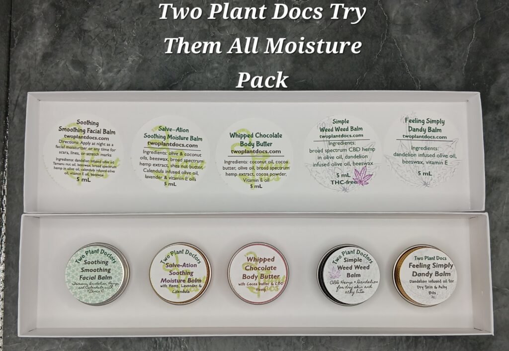 Rectangular box containing small tins of different colors.