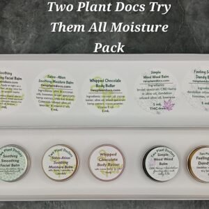 Rectangular box containing small tins of different colors.