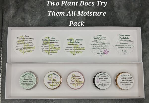 Rectangular box containing small tins of different colors.
