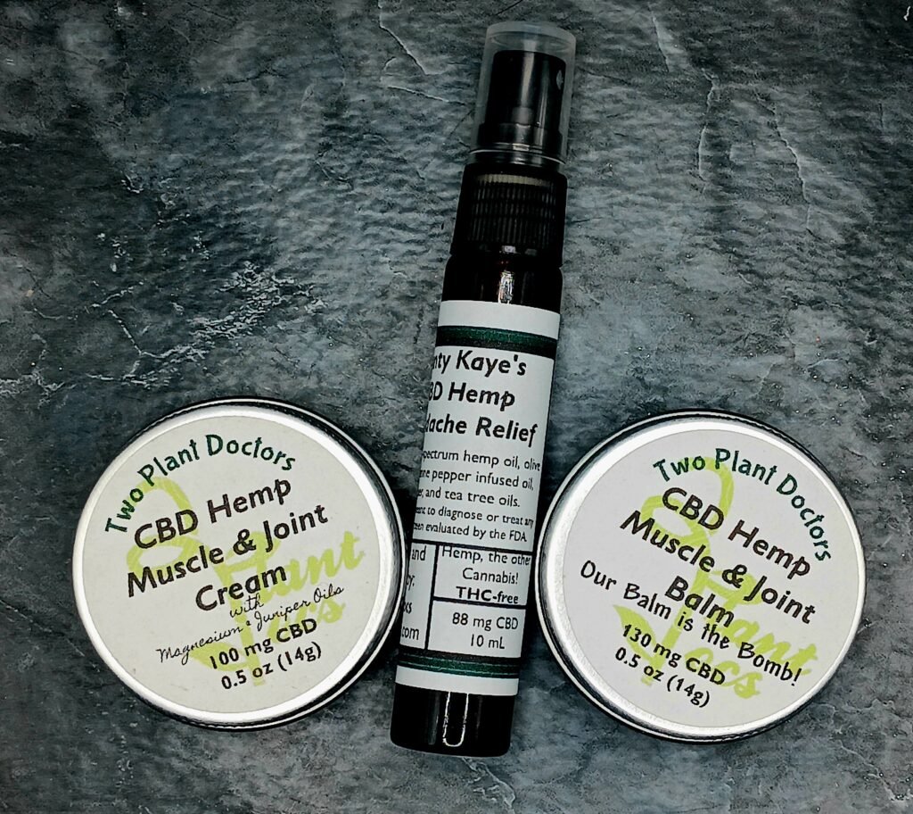 two small tins and a small bottle