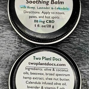 Two round black tins with white labels.