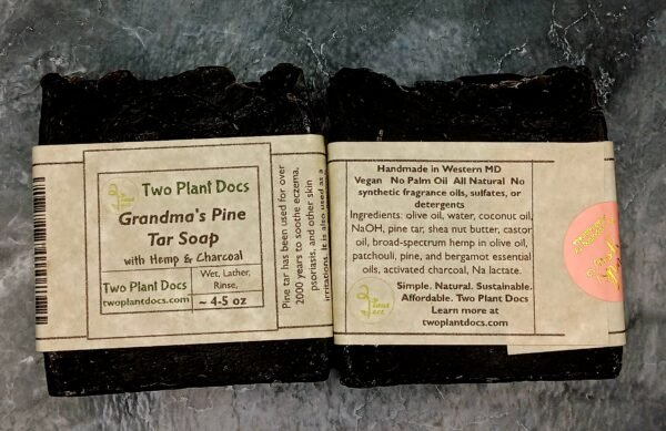 Two square black Grandma's Pine Tar Soaps