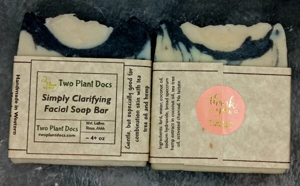 Two square Simply Clarifying Facial Soaps. One picture of the front, and one picture of the back.
