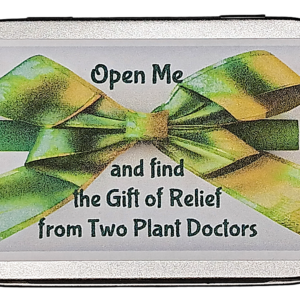 top of a silver rectangular tin with label stating, "Open Me and find the Gift of Relief from Two Plant Doctors"
