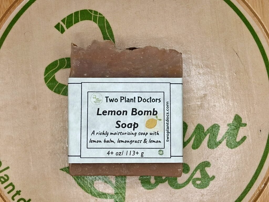 Front of Lemon Bomb Soap wrapped in green paper