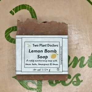 Front of Lemon Bomb Soap wrapped in green paper